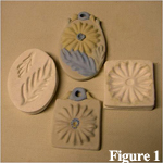 Modern sprig molding were created by prssing clay into small molds as shown here - click on image to see a larger view.